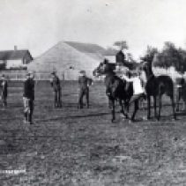 T.L. Kennedy's recruits trained on the Cooksville Fair Grounds. Pictured here in 1914, they learn to wrestle on horseback.